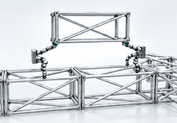 Dual-arm assembly configuration: two arms on a truss carrying a structural unit together